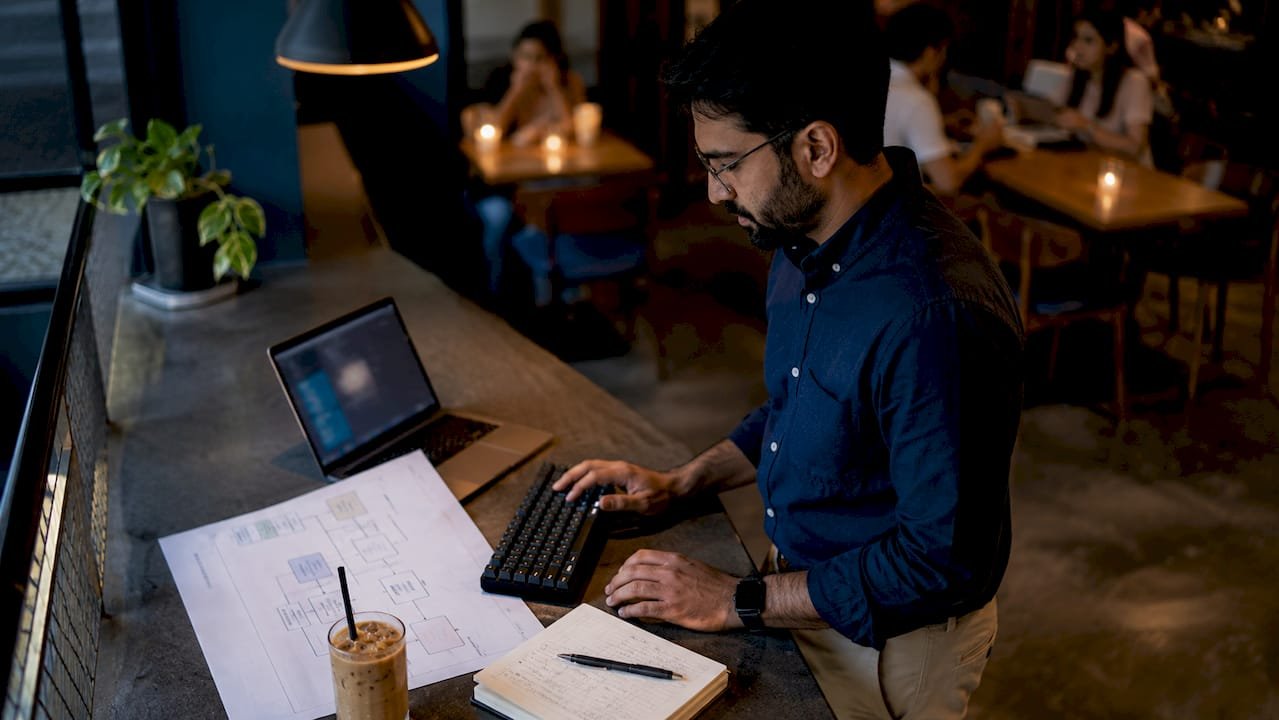Data engineer working at desk with data automation setup