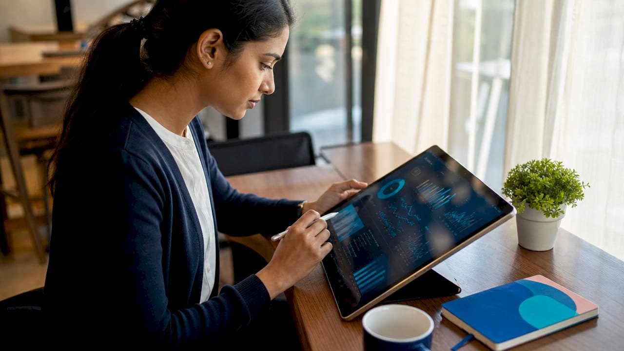 Data analyst working on data visualization at home